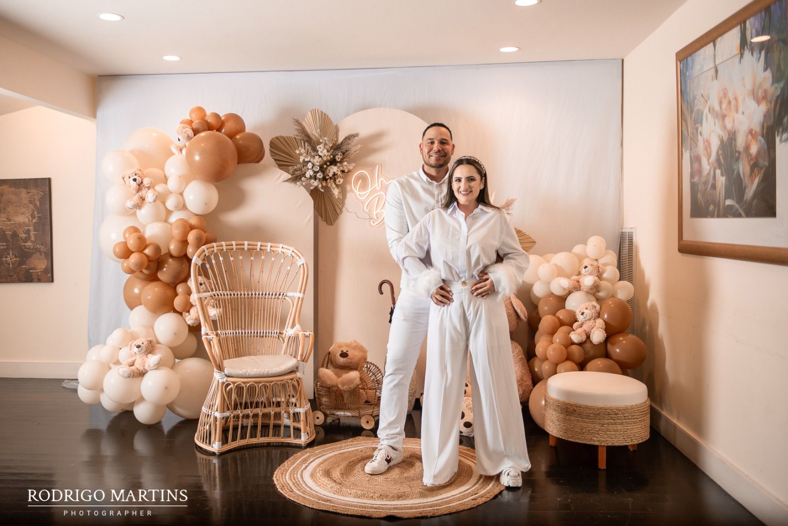 Soft, elegant baby shower setup and balloon garland in Cape Cod